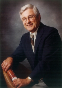 a grey background with Dr. Cooper smiling at the camera 