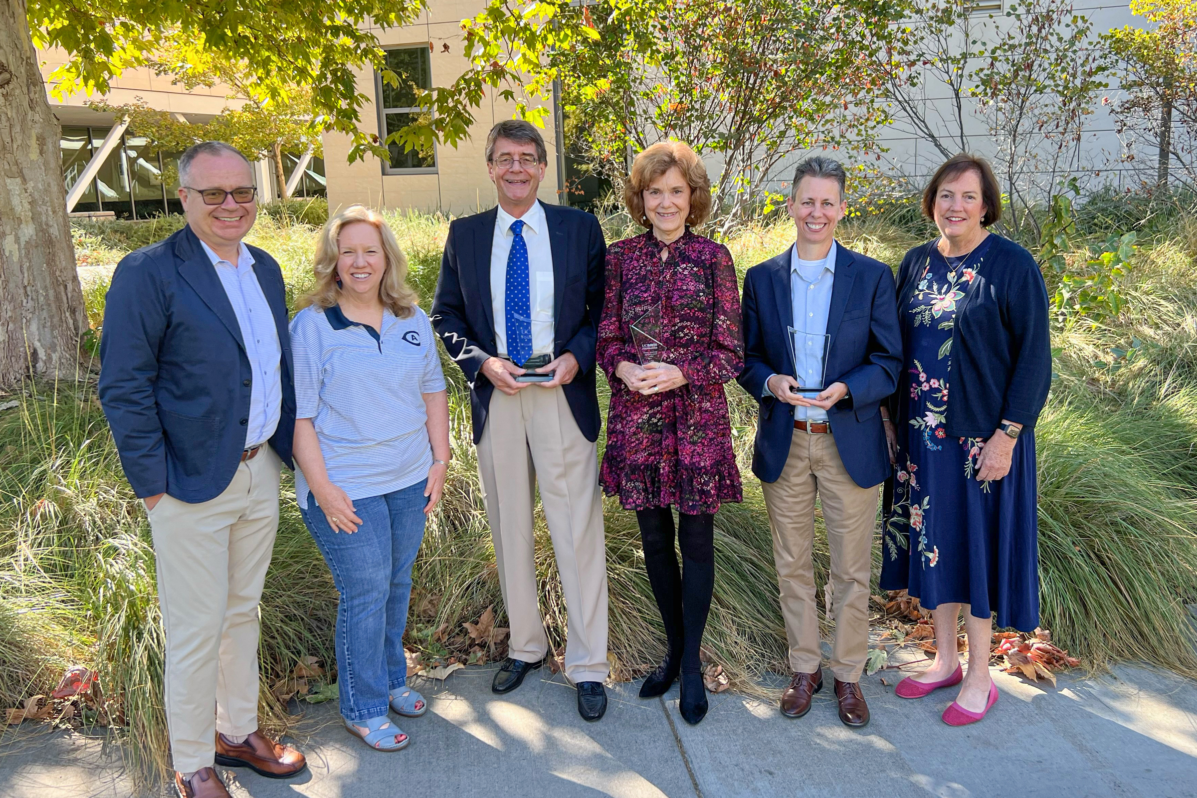 Group of people, including UC Davis leadership and Faculty and Staff Stewardship awardees, pose for a photo